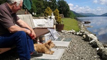 Briar Cottages Loch Garden with Maisy the dog and Billy enjoying Loch Earn