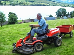 Frasers Lawnmore -cutting the paddock at Briar Cottages