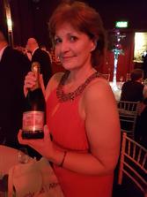 Kim Proven with Prestonfield House Champagne to celebrate LETi tourism groups 2nd Scottish Regional Thistle Award for tourism