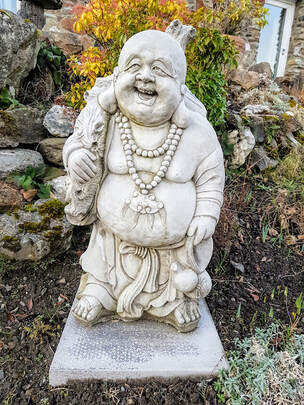 Laughing Buddha at Briar Cottages