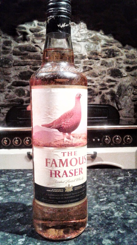 The Famous Fraser labelled Grouse Whiskyslyv