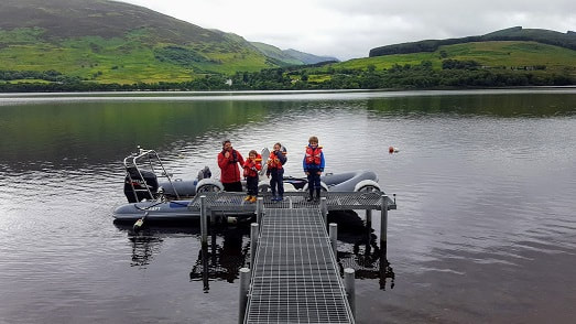 Guest rib tied at Briar Cottages jetty Loch Earn