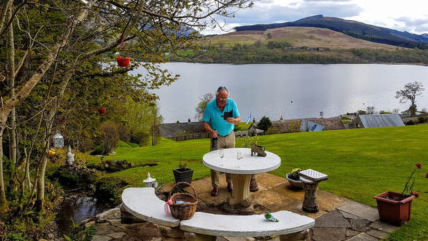 Top of the garden picnic spot by a stream at Briar Cottages Lochearnhead