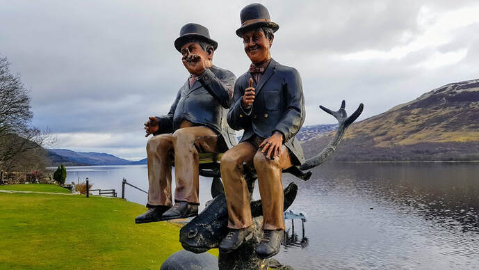 Stan and Ollie figures pose with Stan The Stag. Loch Earn