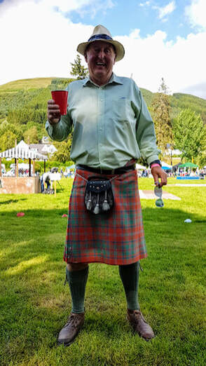 Fraser in a kilt enjoying the annual BLS highland Games in Lochearnhead, July