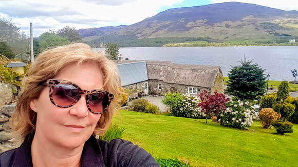Kim Proven in the garden in summer,Loch Earn