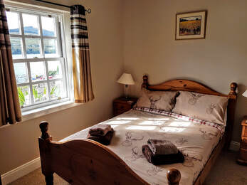 Double bed in Little Briar Cottage Lochearnheadure