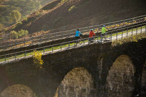 3 cyclists on Glenogle Viaduct, photo by  Andy McCandlish, funded by Sustrans   