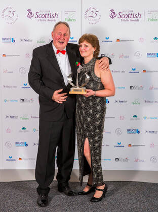 PicFraser and Kim with the National Scottish Thistle Award on behalf of LETi fror Innovation In Tourism -BLiSS trail 2017