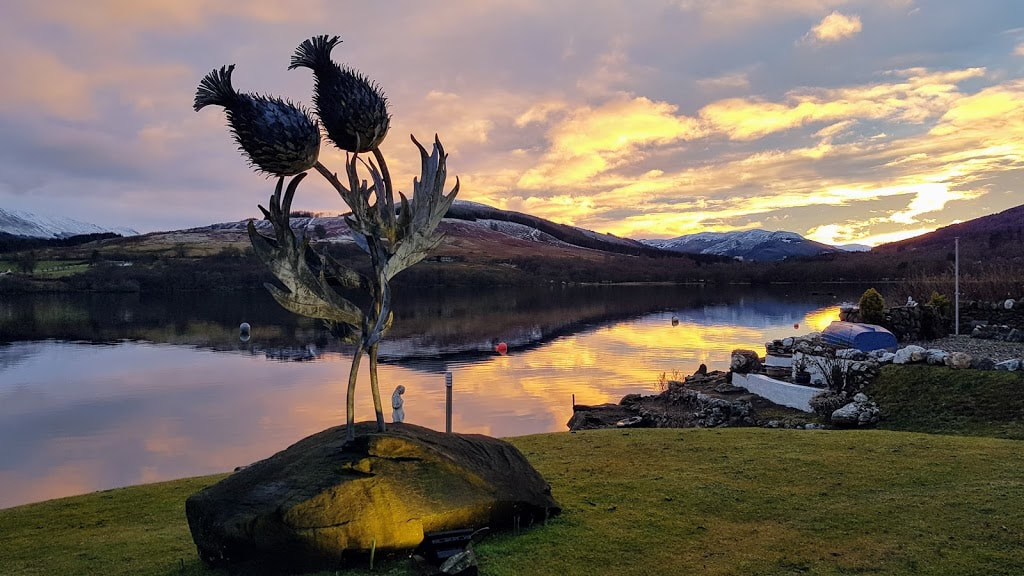 Thistle sculpture in sunset Briar Cottages